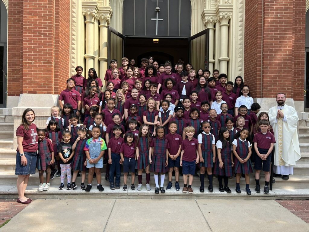 Resurrection Catholic School students gathered on the church steps, 2025