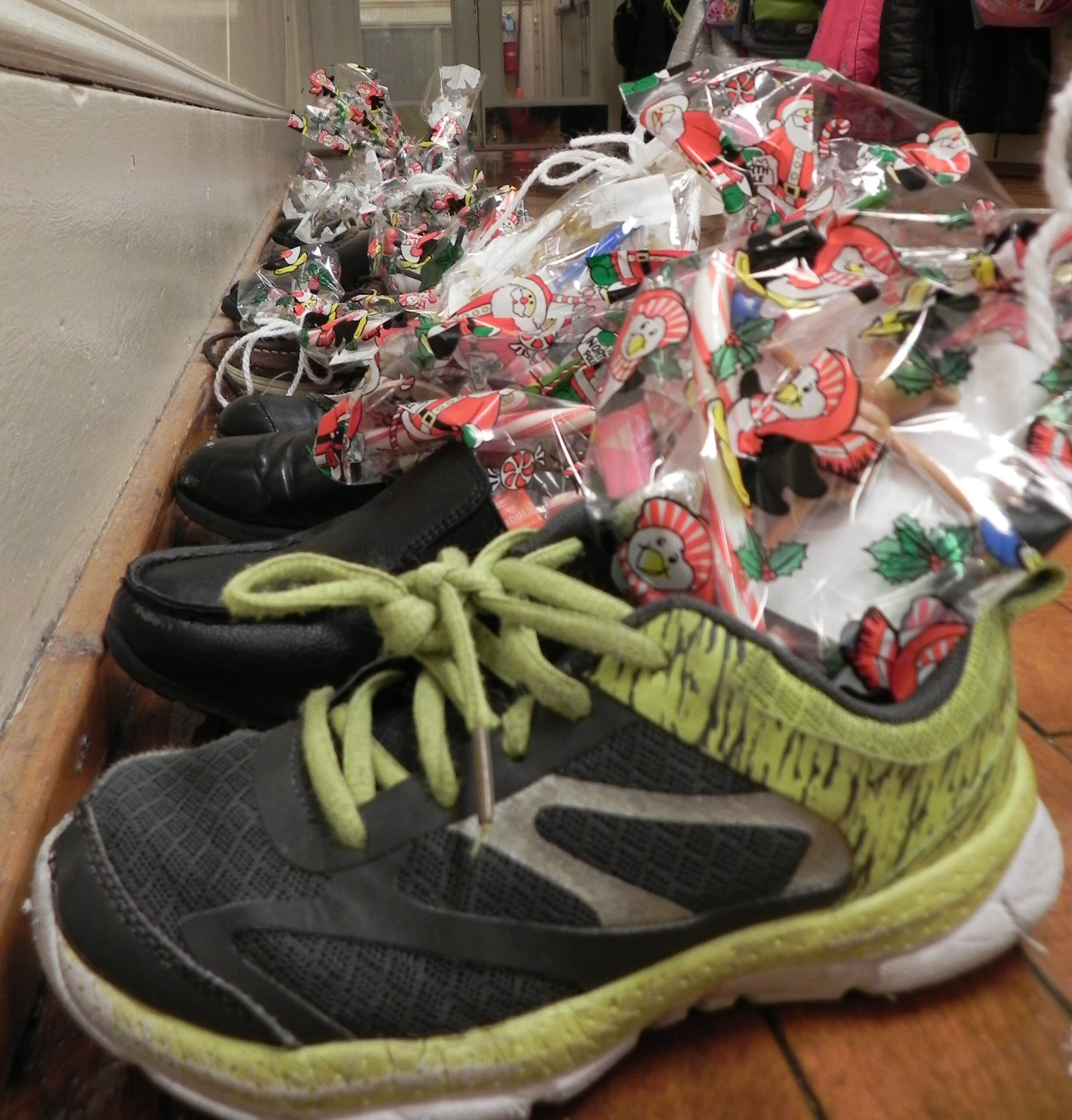 Students give on day of sharing, receive surprise visit on St. Nick day
